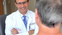 Dr. Lawrence Lenke talks with a spine patient at the Och Spine Hospital